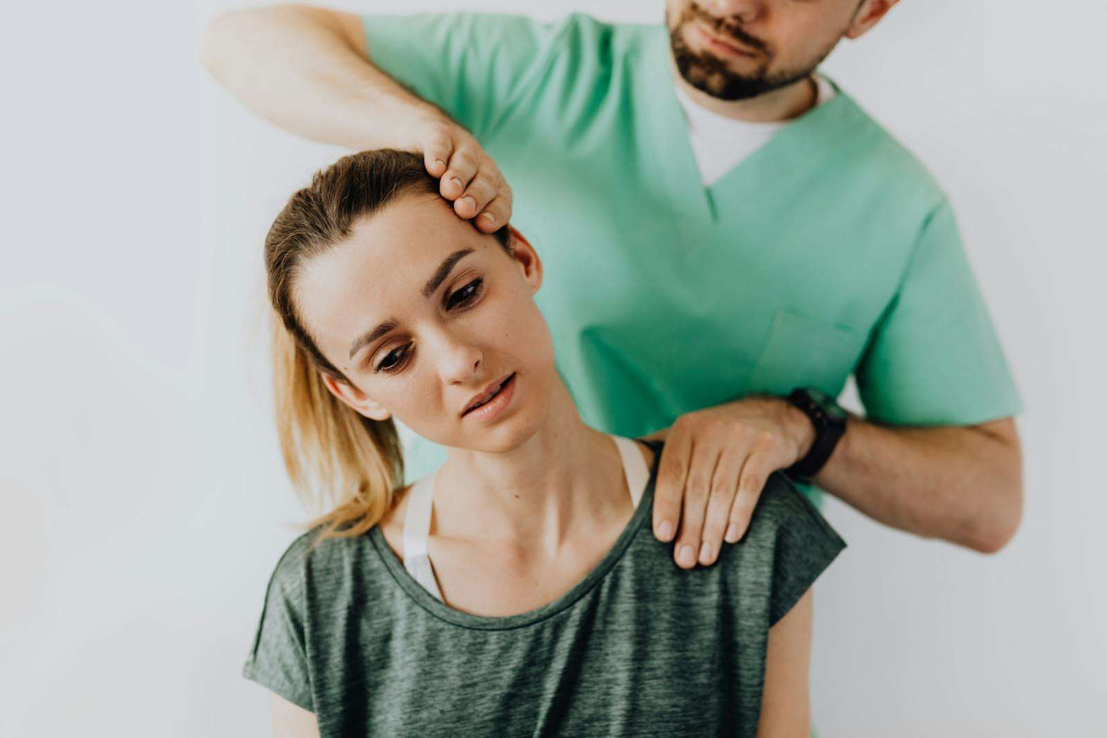 Physiotherapist guiding a patient through a strength exercise