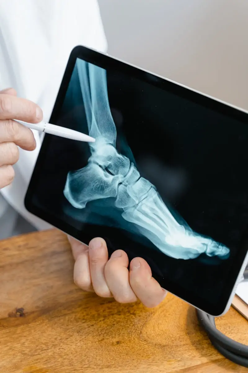 Clinician reviewing a foot X-ray on a tablet